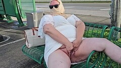 Mature hijab Milf masturbating with big dildo publicly outdoor at bus stop with cars passing by Thumb