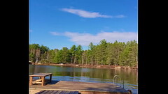 Petite Blonde jumps off a dock into a lake completely naked Thumb