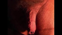 Mature guy with a long foreskin &amp_ low hangers massages his cock. Thumb