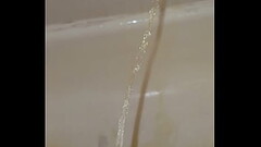 Marking my shower with a full bladder and an erection. Thumb