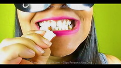 Girl with beautiful teeth crumpled chewed up candy chewing gum nuts to mud chew videos, look her ver Thumb
