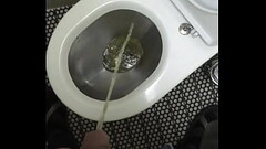 Man pissing in the train toilet Thumb