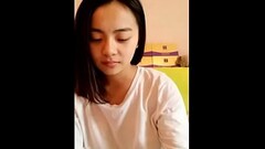 Young Asian teen showing her smooth body Thumb