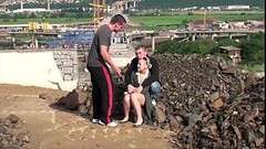 Blonde young woman is fucked by 2 guys in public Thumb